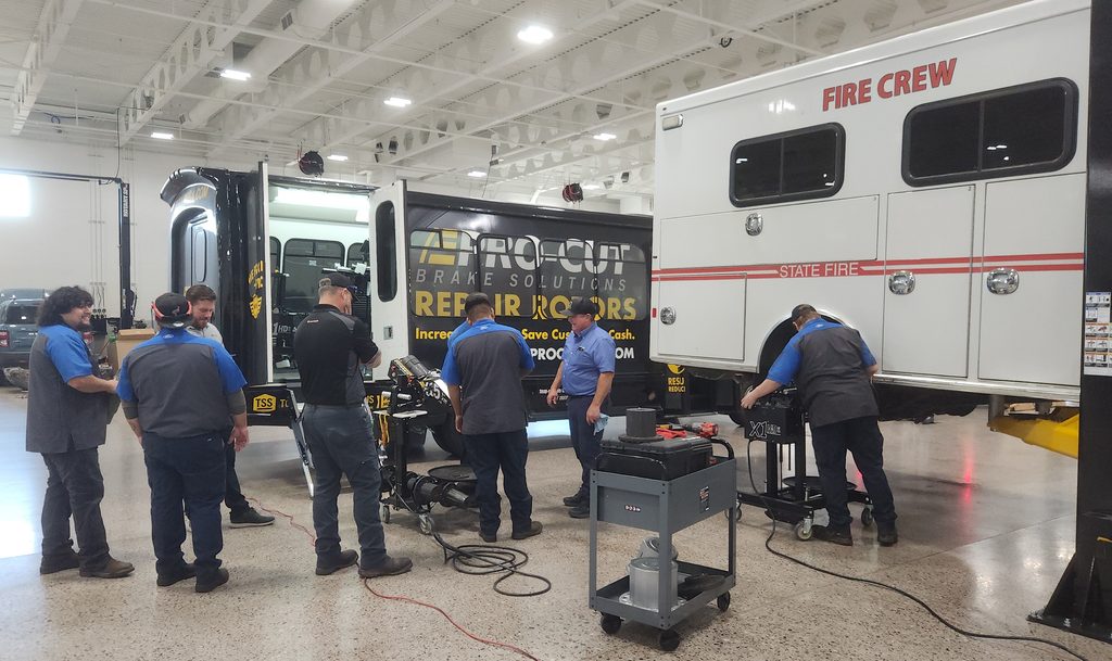 Technicians using Pro-Cut equipment on a Fire Service Vehicle